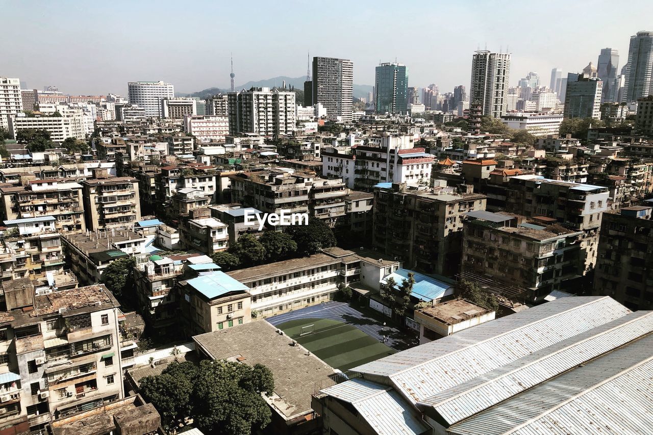 High angle view of buildings in city against sky