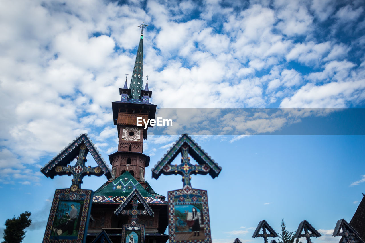 Low angle view of traditional building against blue sky