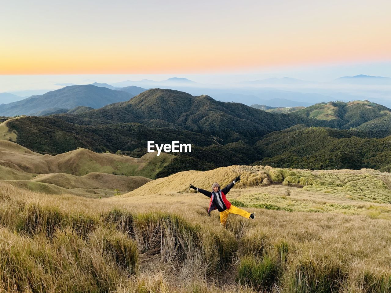 Full length of man on field against mountain range