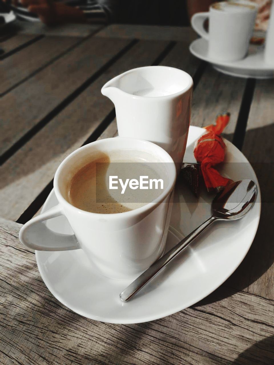 HIGH ANGLE VIEW OF COFFEE CUP AND TEA ON TABLE