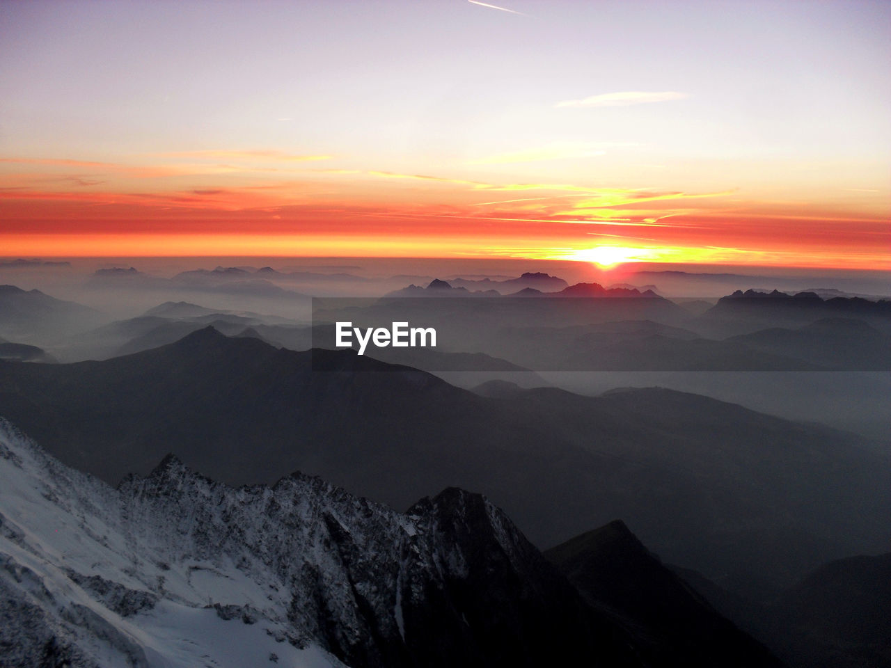 Scenic view of mountains against sky during sunset