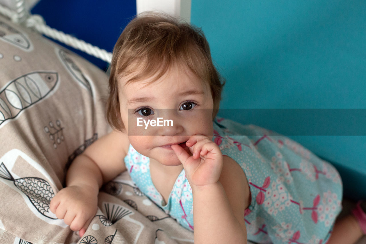 Portrait of cute baby at home