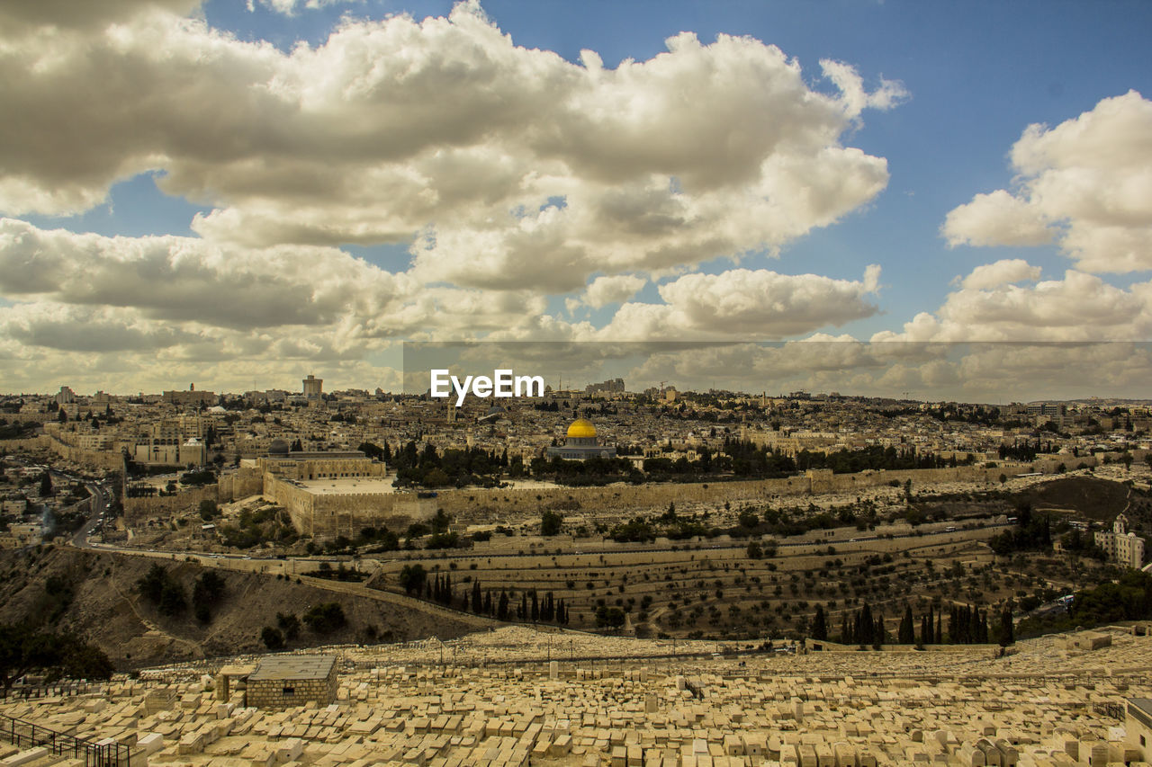 Aerial view of cityscape against sky