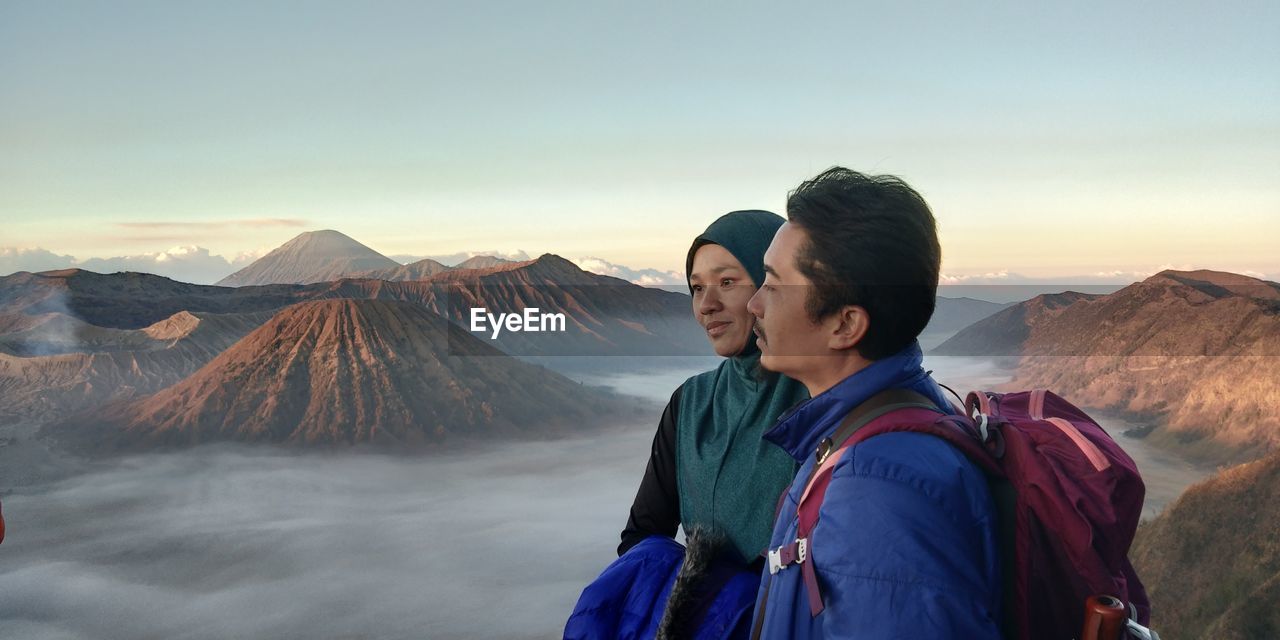 Couple standing against mt bromo