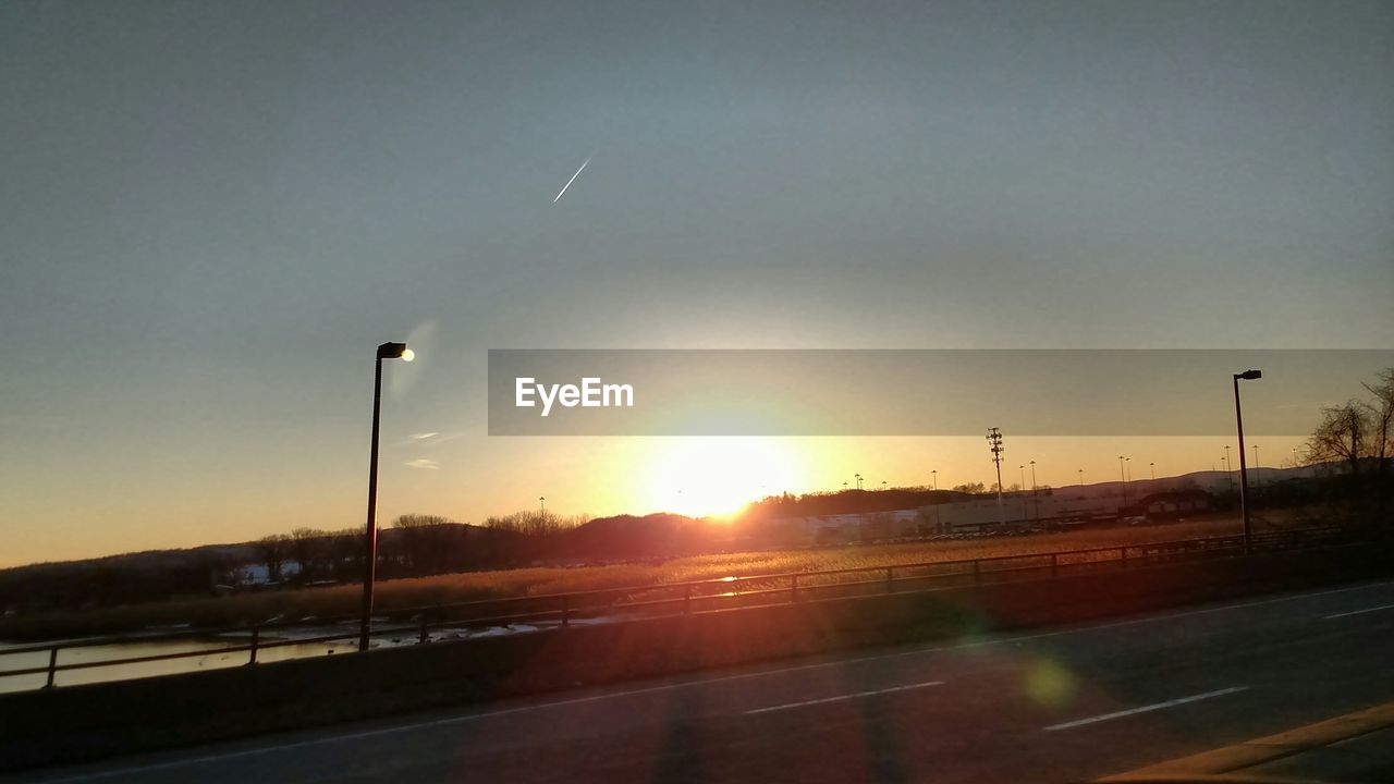 VIEW OF ROAD AT SUNSET