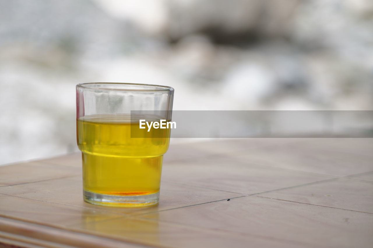 CLOSE-UP OF BEER ON TABLE