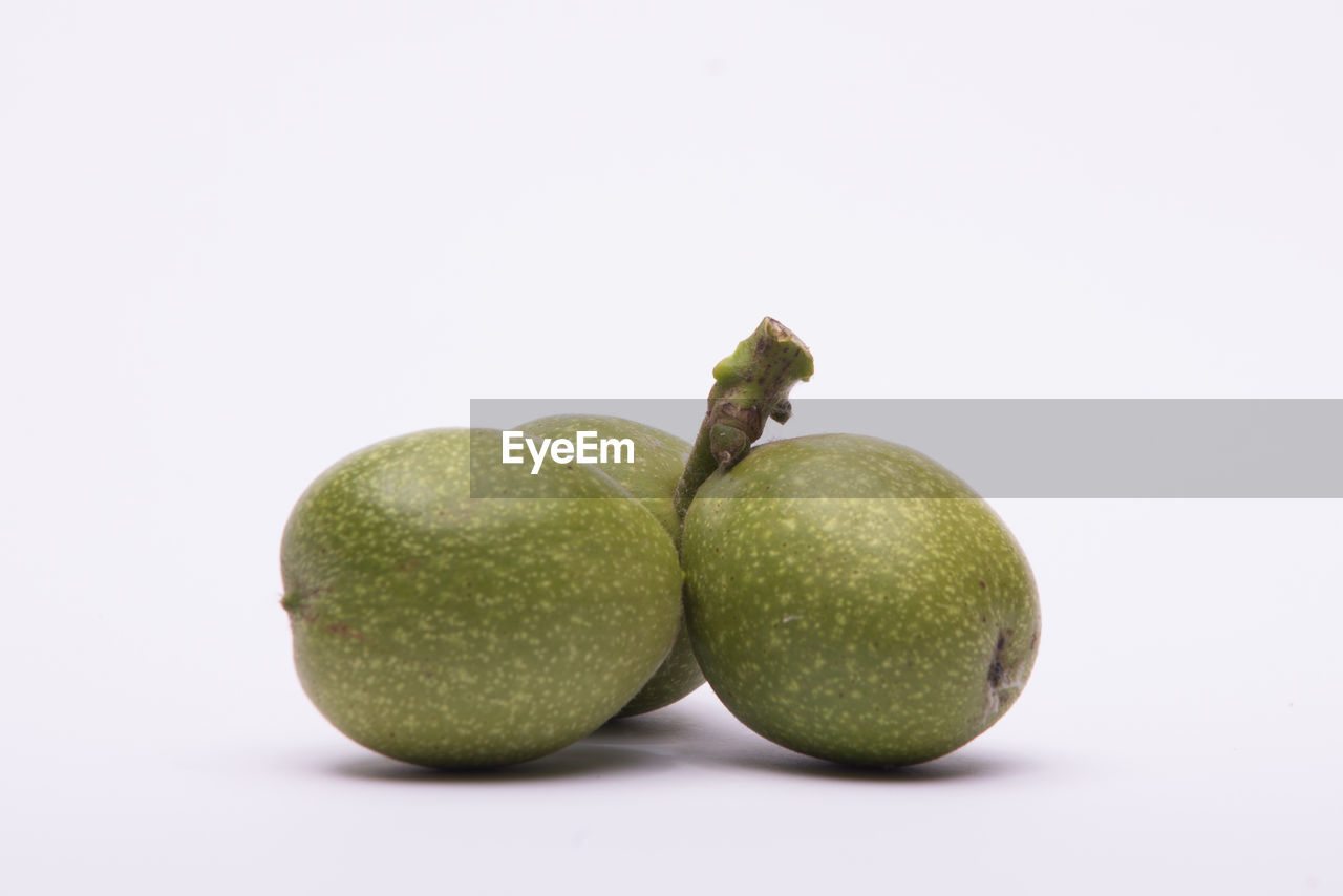 Close-up of fruits on white background