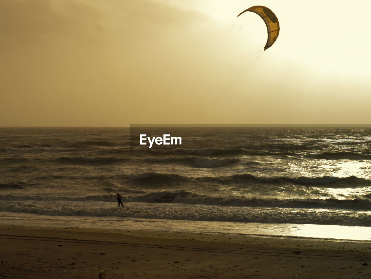 Kitesurfer in the calm ocean