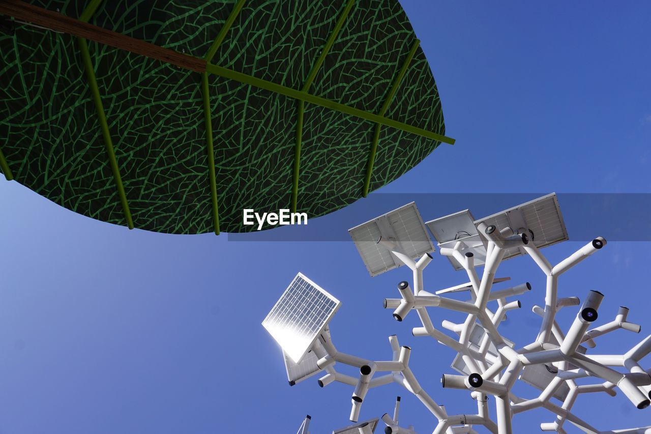 LOW ANGLE VIEW OF WINDMILL AGAINST CLEAR SKY