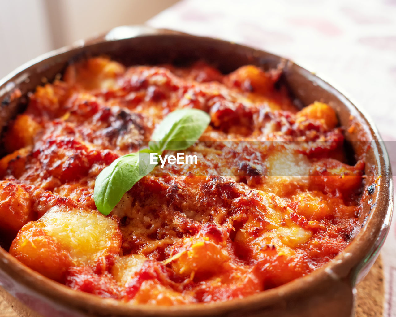 CLOSE-UP OF PIZZA SERVED ON TABLE