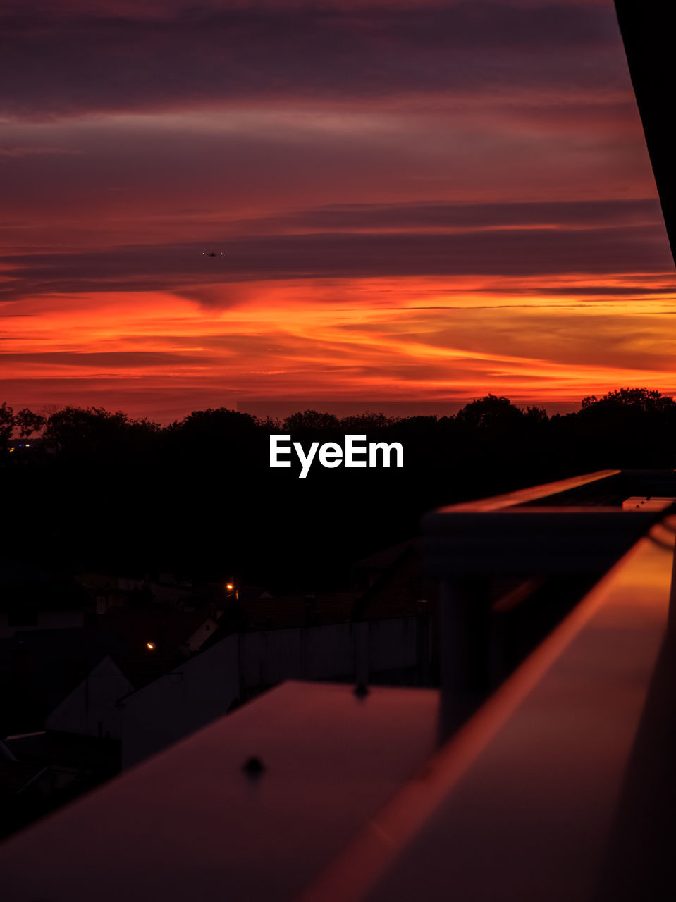 SCENIC VIEW OF SILHOUETTE TREES AGAINST ORANGE SKY