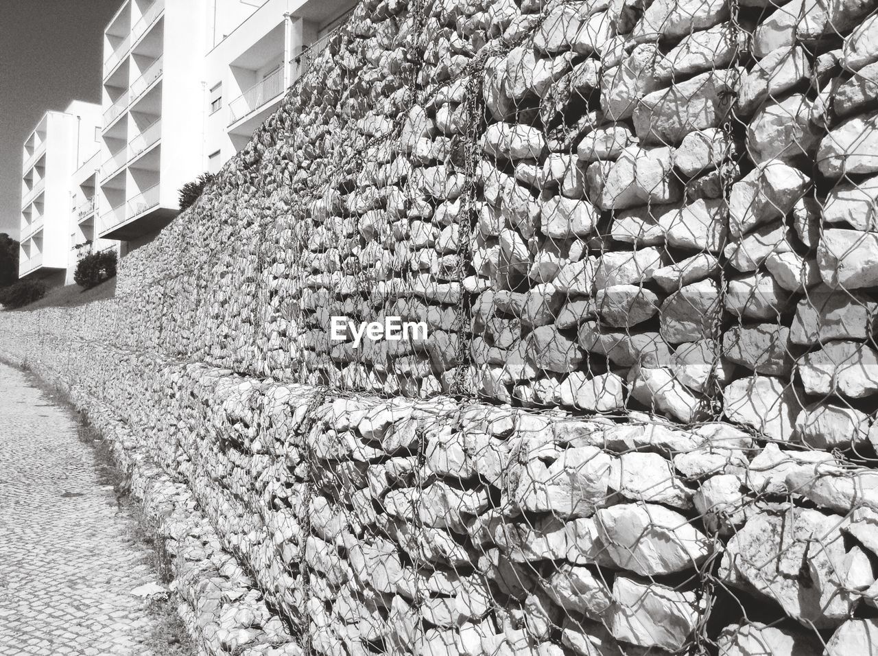 Metal fence on stacked stones