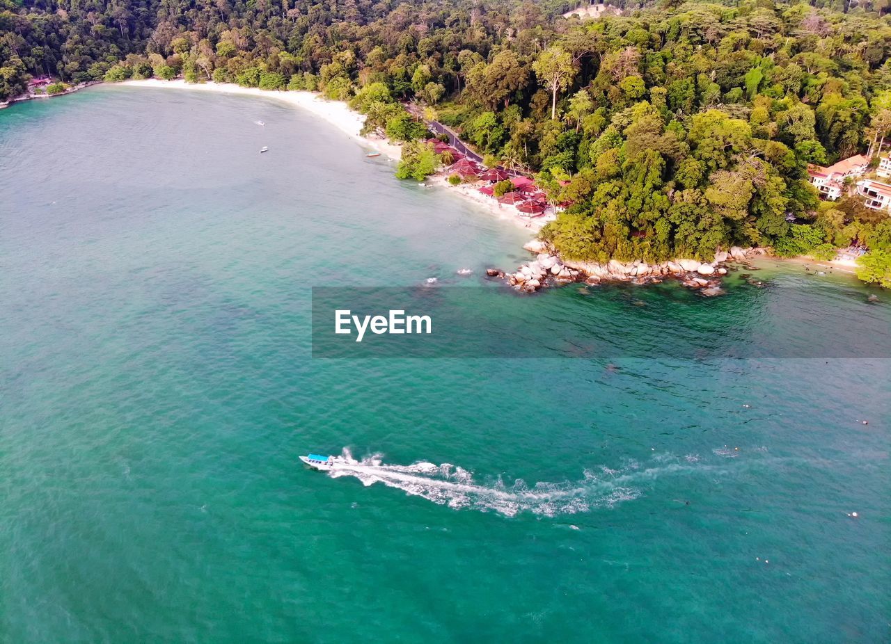 Aerial view of motorboat sailing in sea