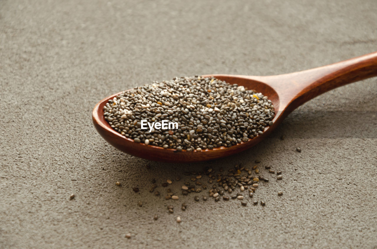 Chia seeds on a wooden spoon, the concept of healthy nutrition