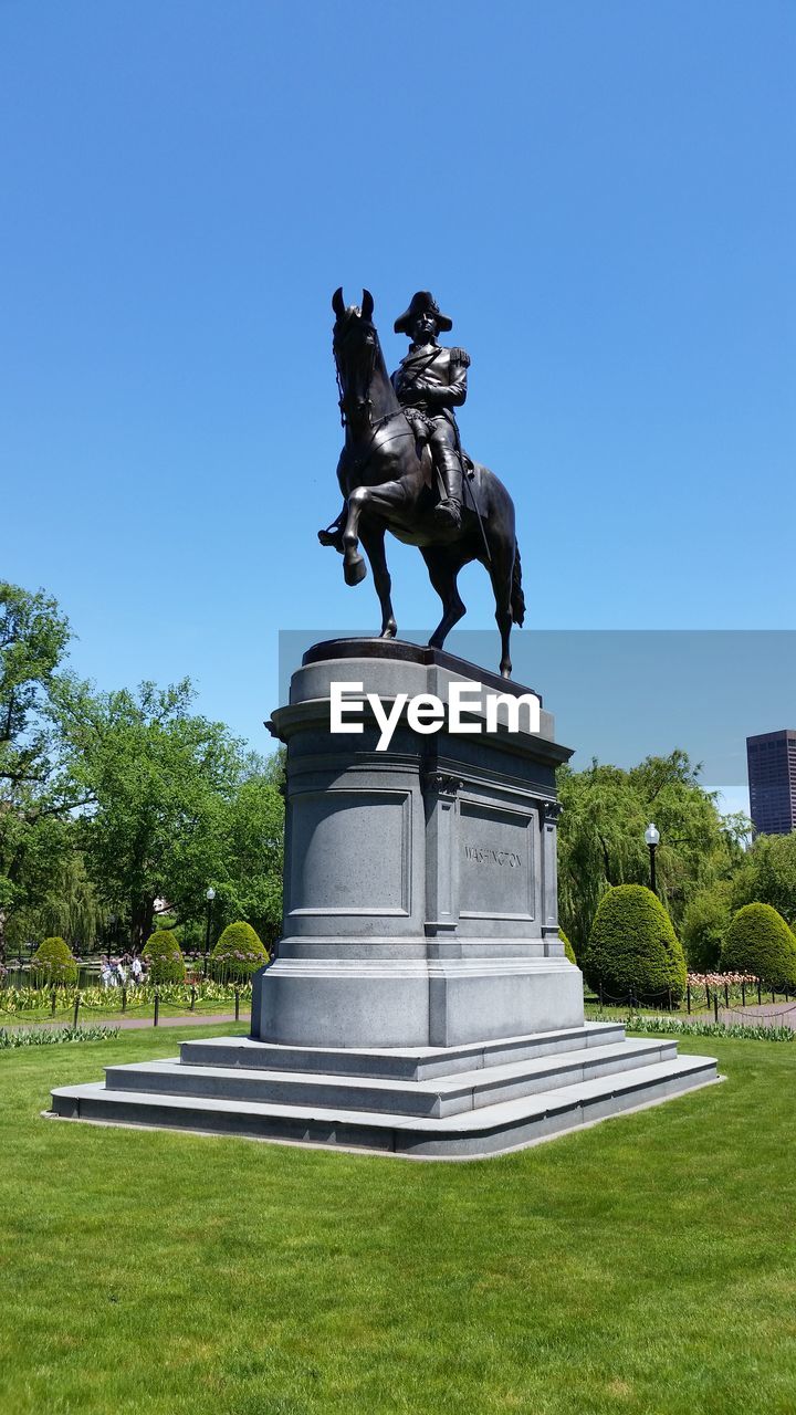 STATUE IN PARK AGAINST SKY