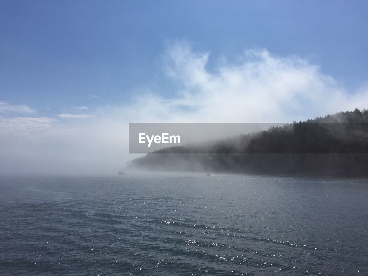 Scenic view of sea against sky during foggy weather
