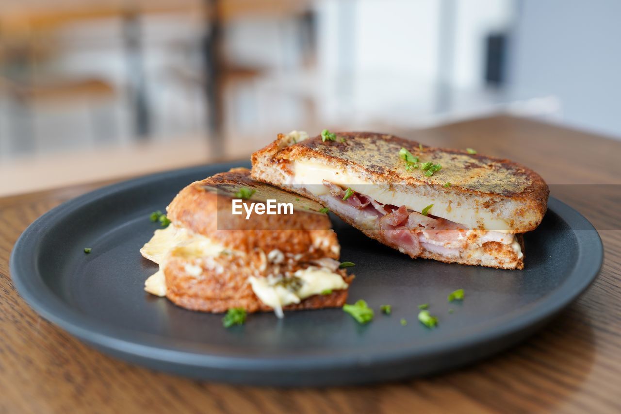 Close-up of breakfast served in plate on table