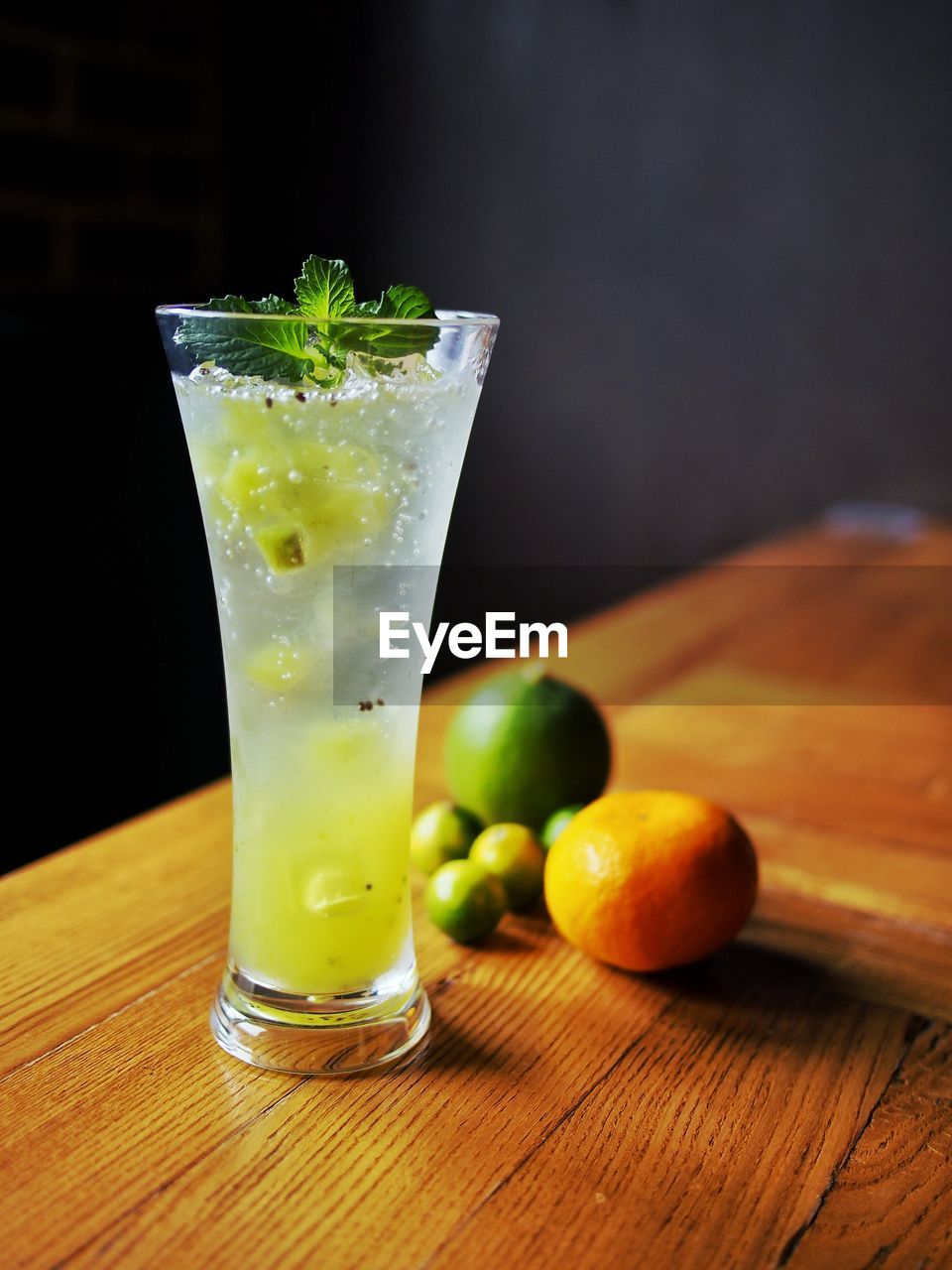 GREEN FRUITS ON GLASS TABLE