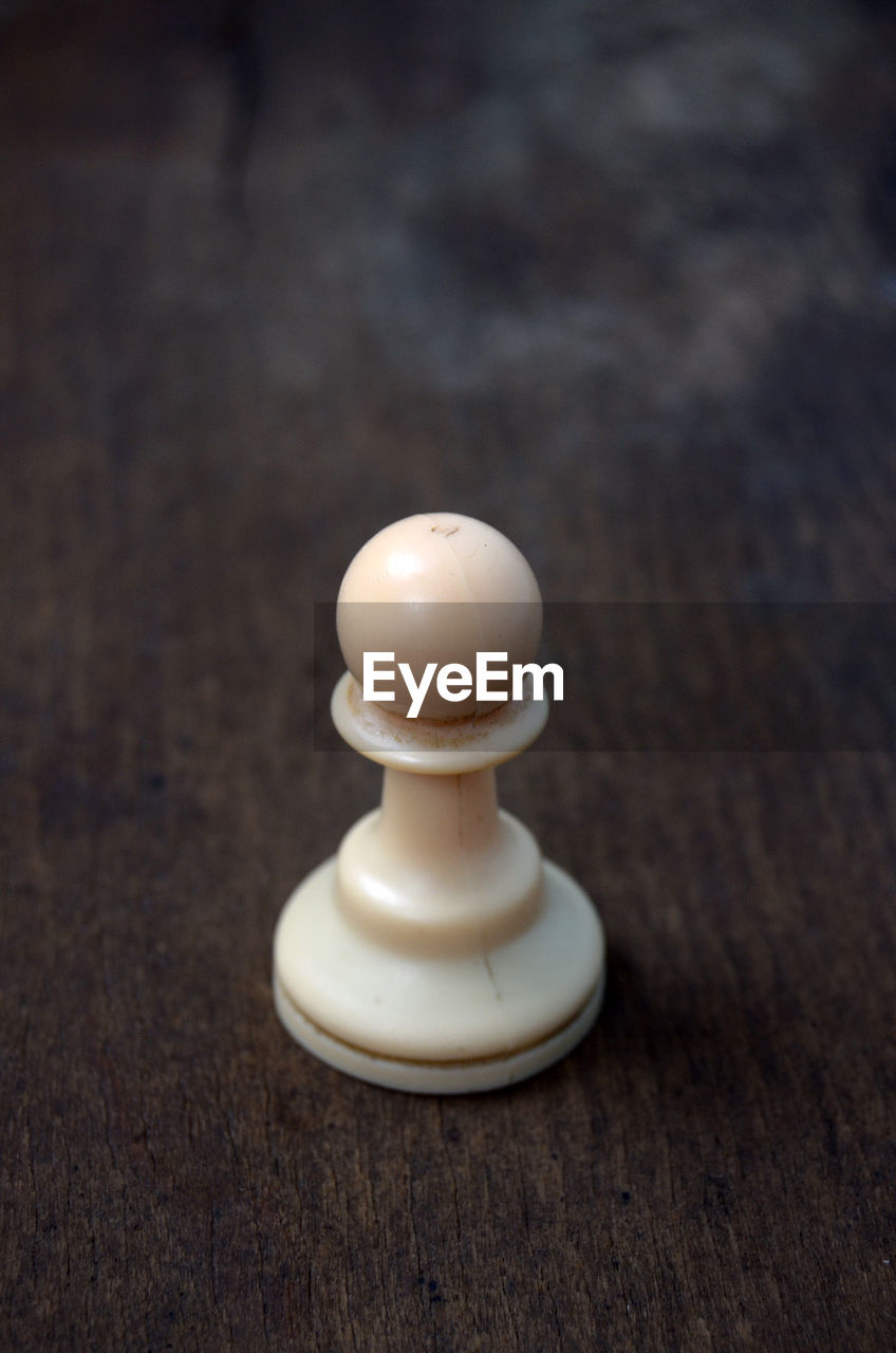 Close-up of chess piece on table