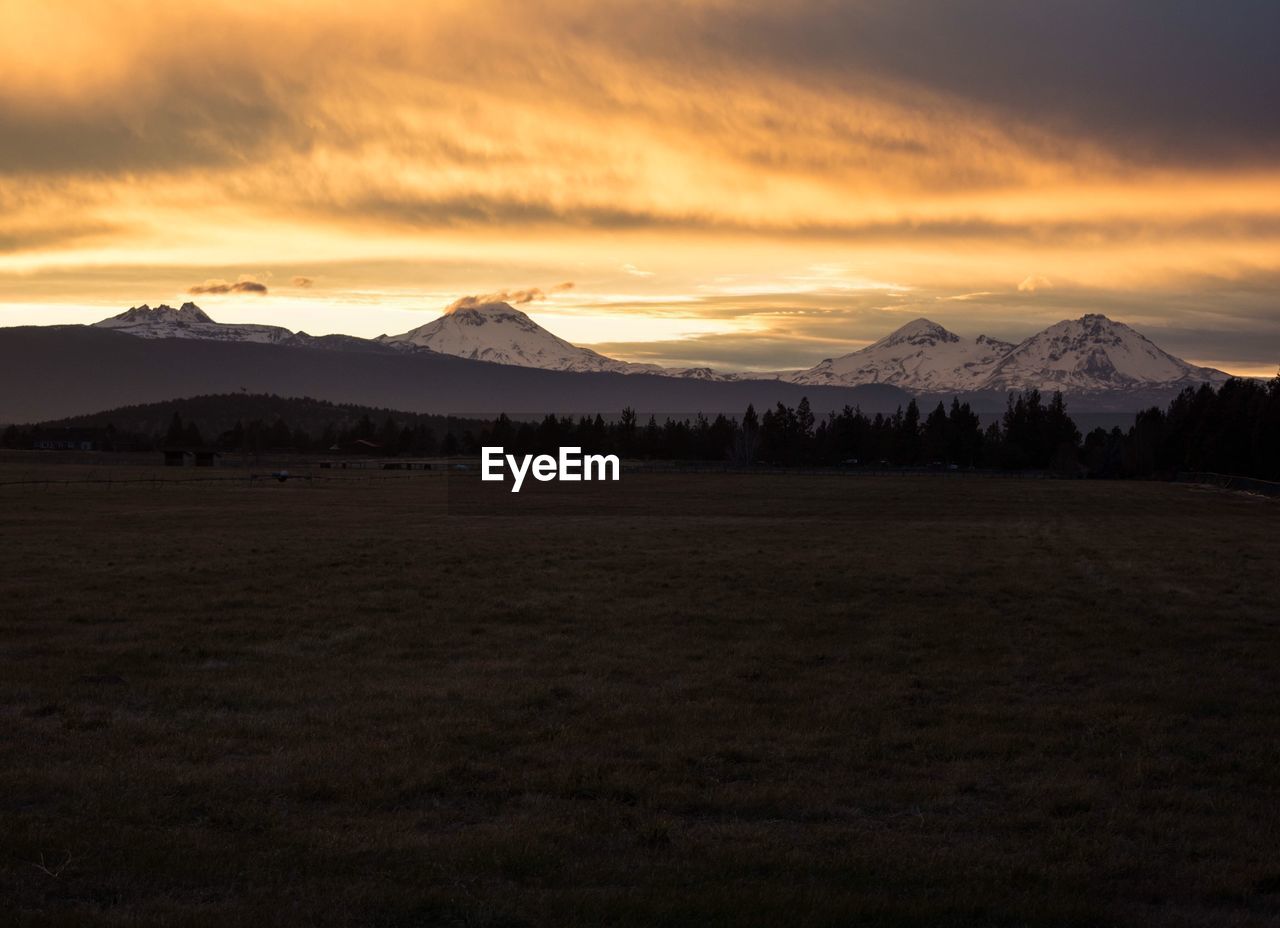 Scenic view of mountains against sky during sunset