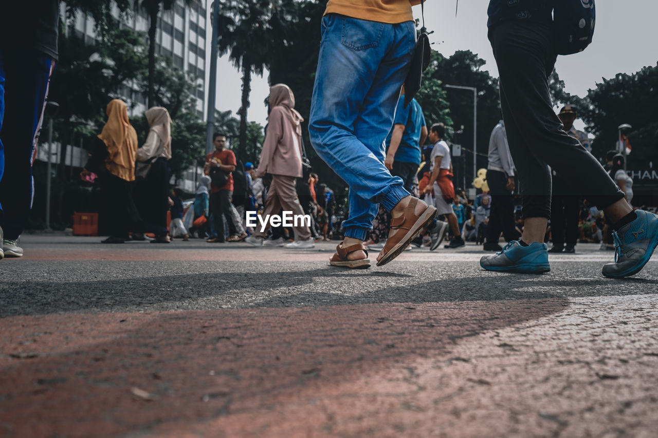 People walking on road in city