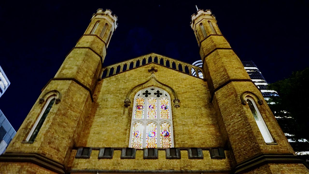 religion, place of worship, architecture, spirituality, low angle view, built structure, night, no people, building exterior, history, travel destinations, outdoors, sky