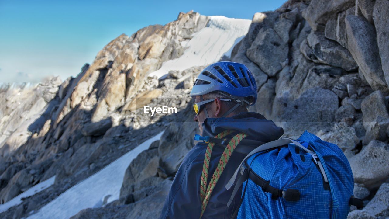 Rear view of person on rockface of mountain