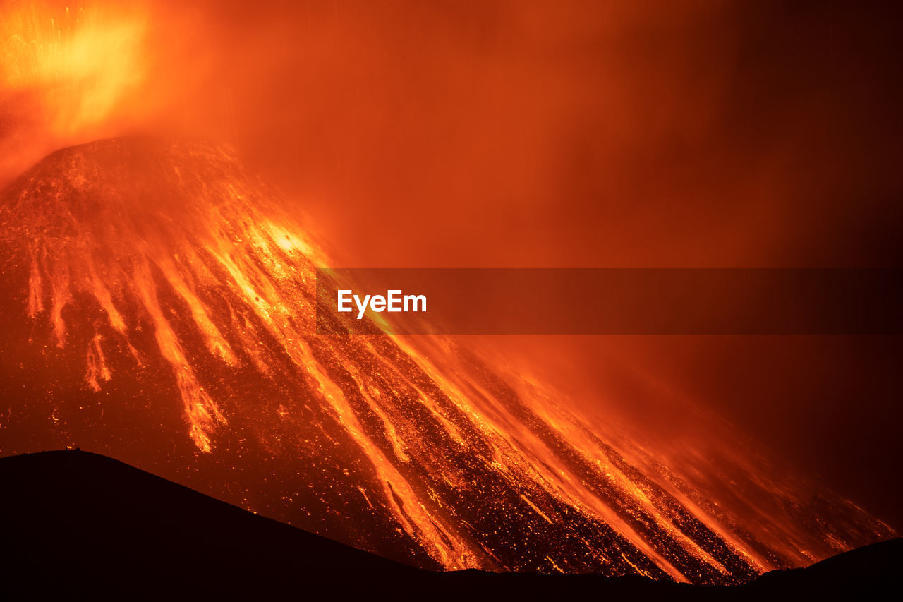 Close-up of red fire during sunset