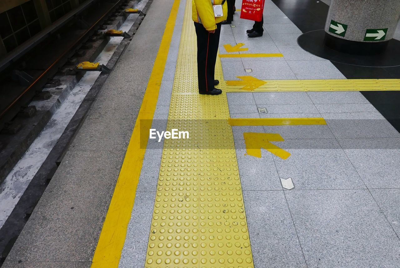 High angle view of man walking on road