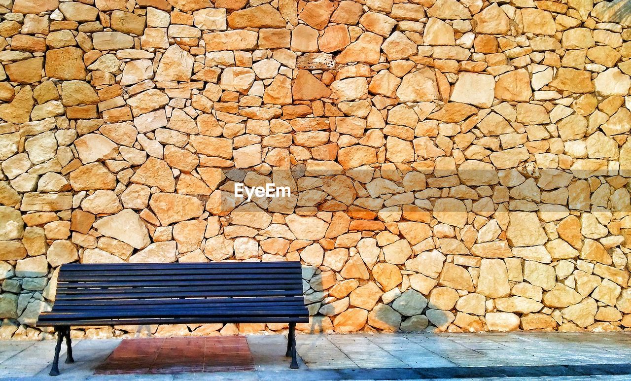 EMPTY CHAIR ON COBBLESTONE