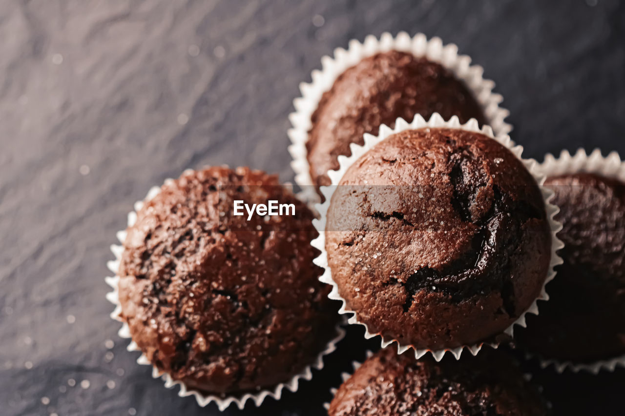 CLOSE-UP OF CUPCAKES ON CAKE