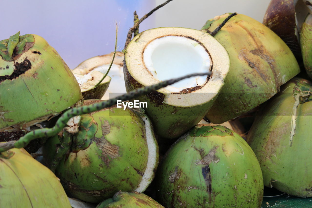 food, food and drink, healthy eating, produce, fruit, wellbeing, plant, green, freshness, tropical fruit, no people, coconut, nature, close-up, group of objects, outdoors, market, day