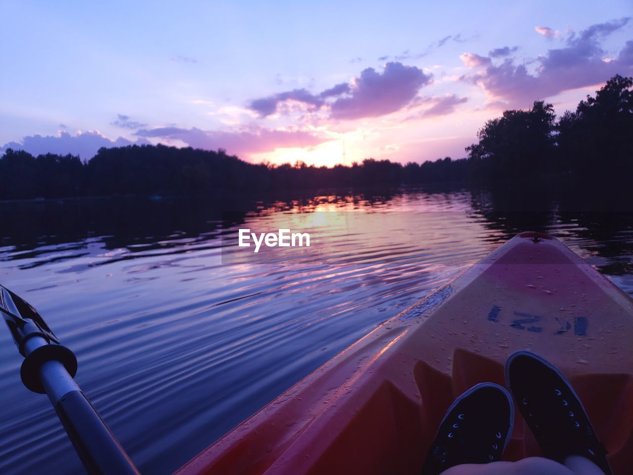 REFLECTION OF SKY ON LAKE DURING SUNSET