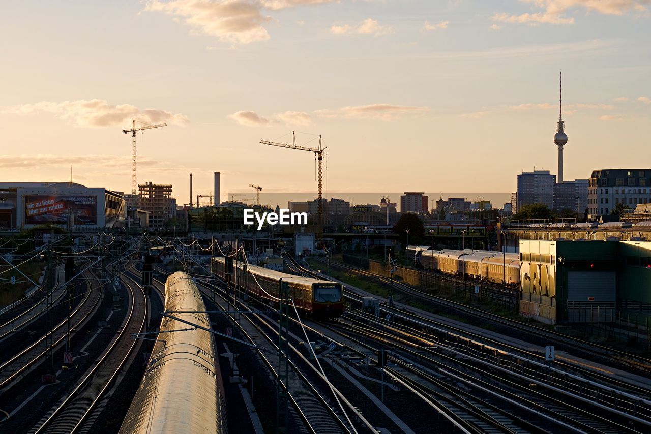 High angle view of railroad tracks against sky at sunset