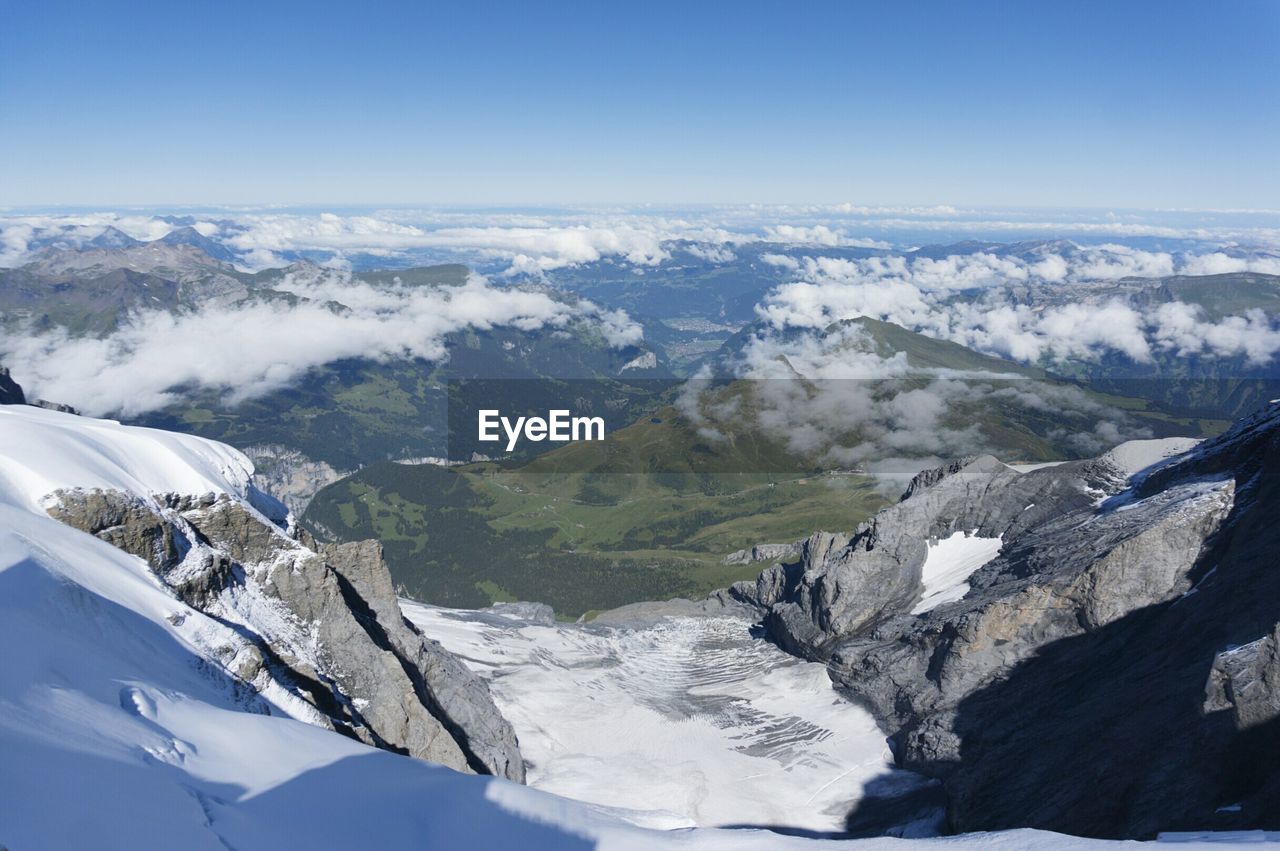 Scenic view of snow covered mountains