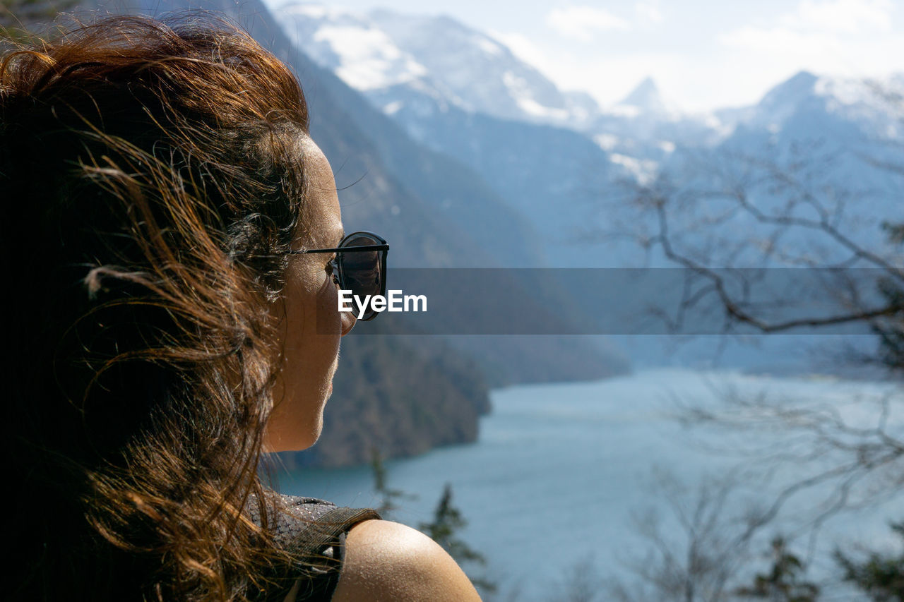 Close-up of woman wearing sunglasses looking away