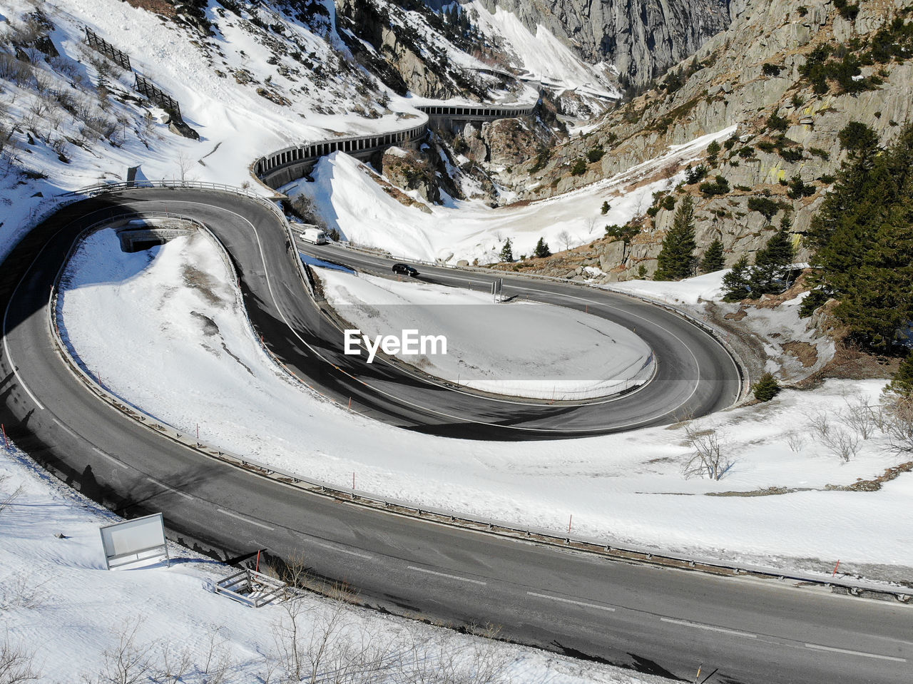 High angle view of snow covered road in european alps