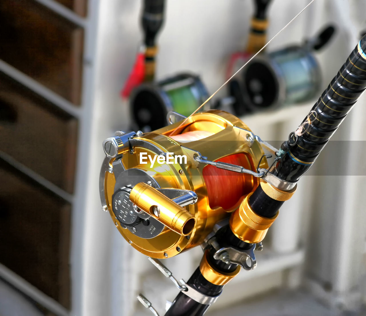 Close-up of a golden fishing reel