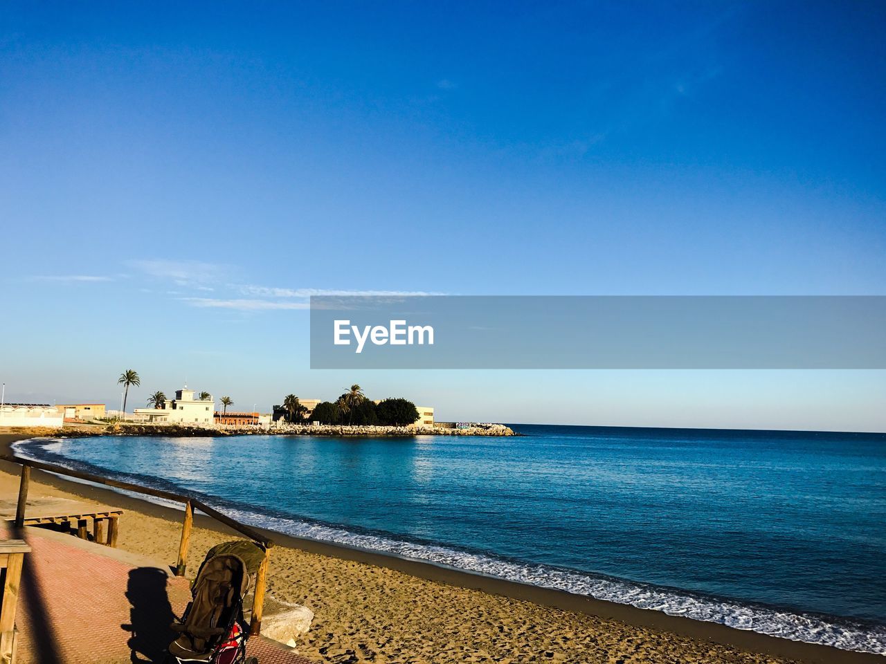 Scenic view of sea against clear blue sky