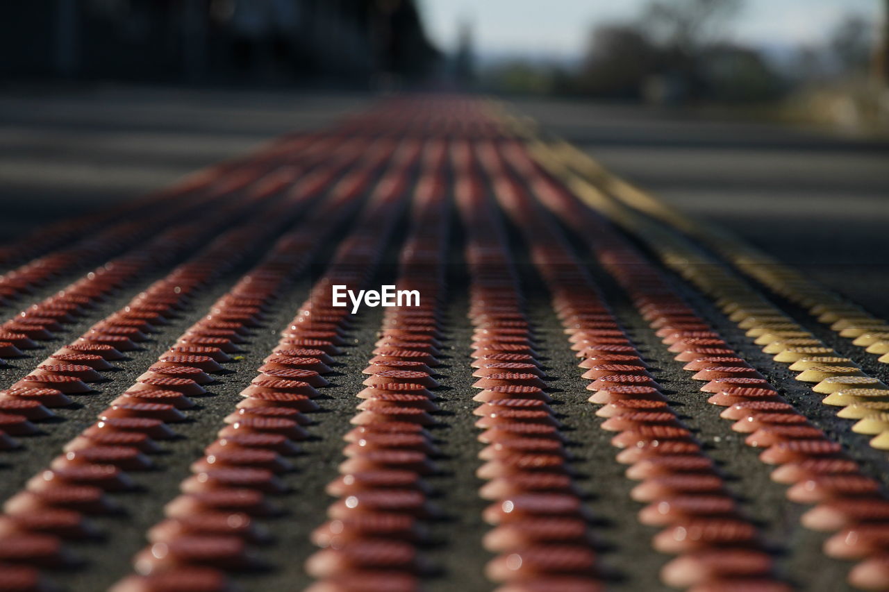 Close-up of railroad station platform