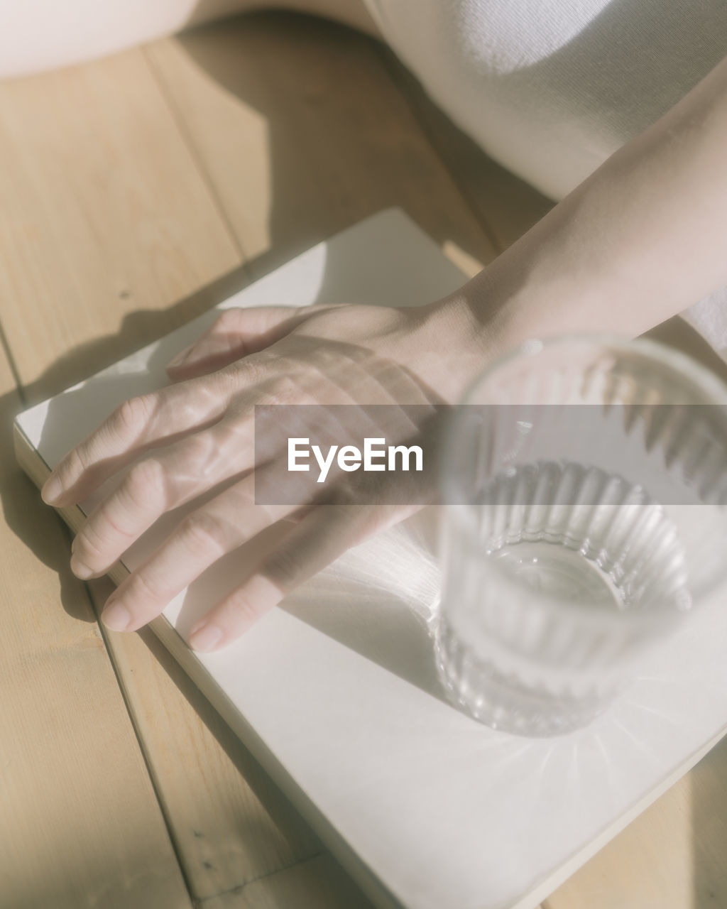 HIGH ANGLE VIEW OF MAN PREPARING FOOD IN GLASS
