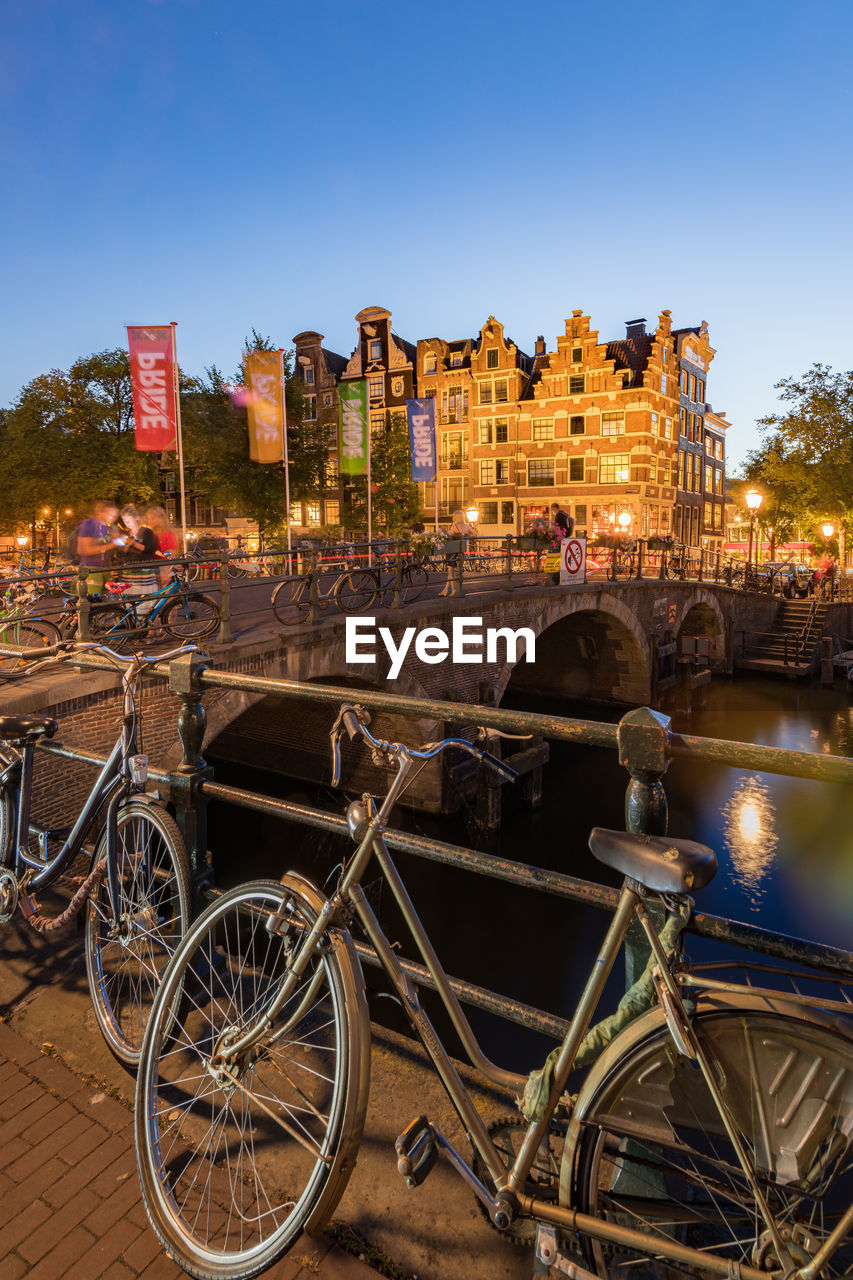 Amsterdam canals with bridge and traditional dutch houses, netherlands