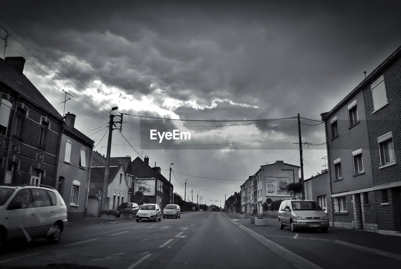 VIEW OF ROAD AGAINST CLOUDY SKY