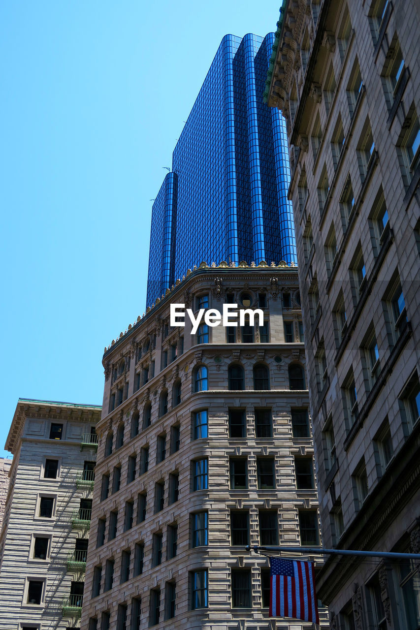 LOW ANGLE VIEW OF MODERN BUILDINGS AGAINST SKY