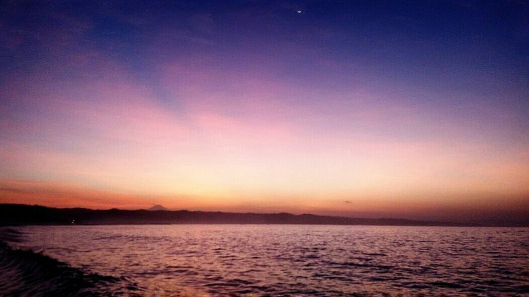 VIEW OF SEA AT SUNSET