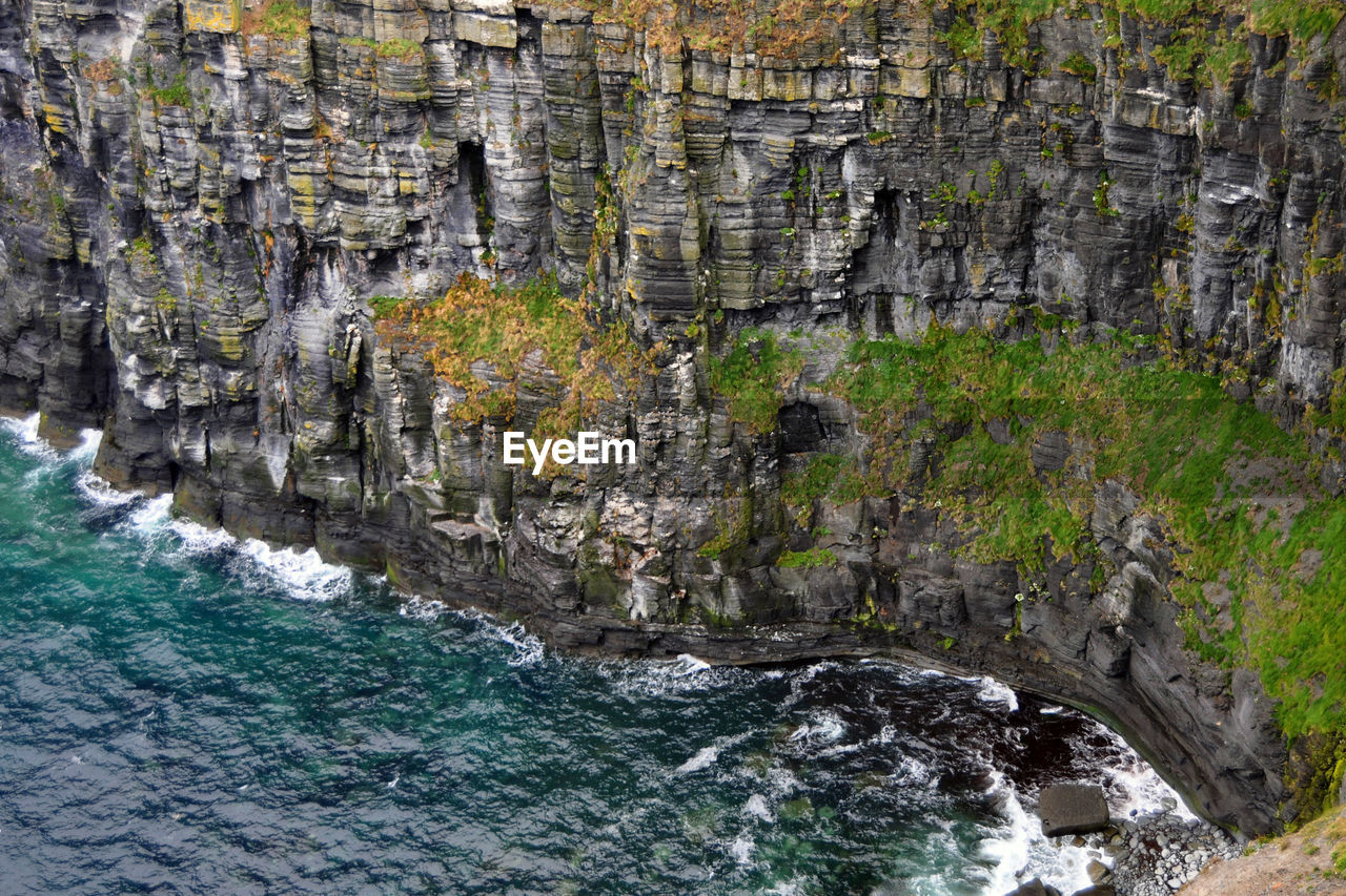 Rock formations of cliffs of moher at seaside in ireland