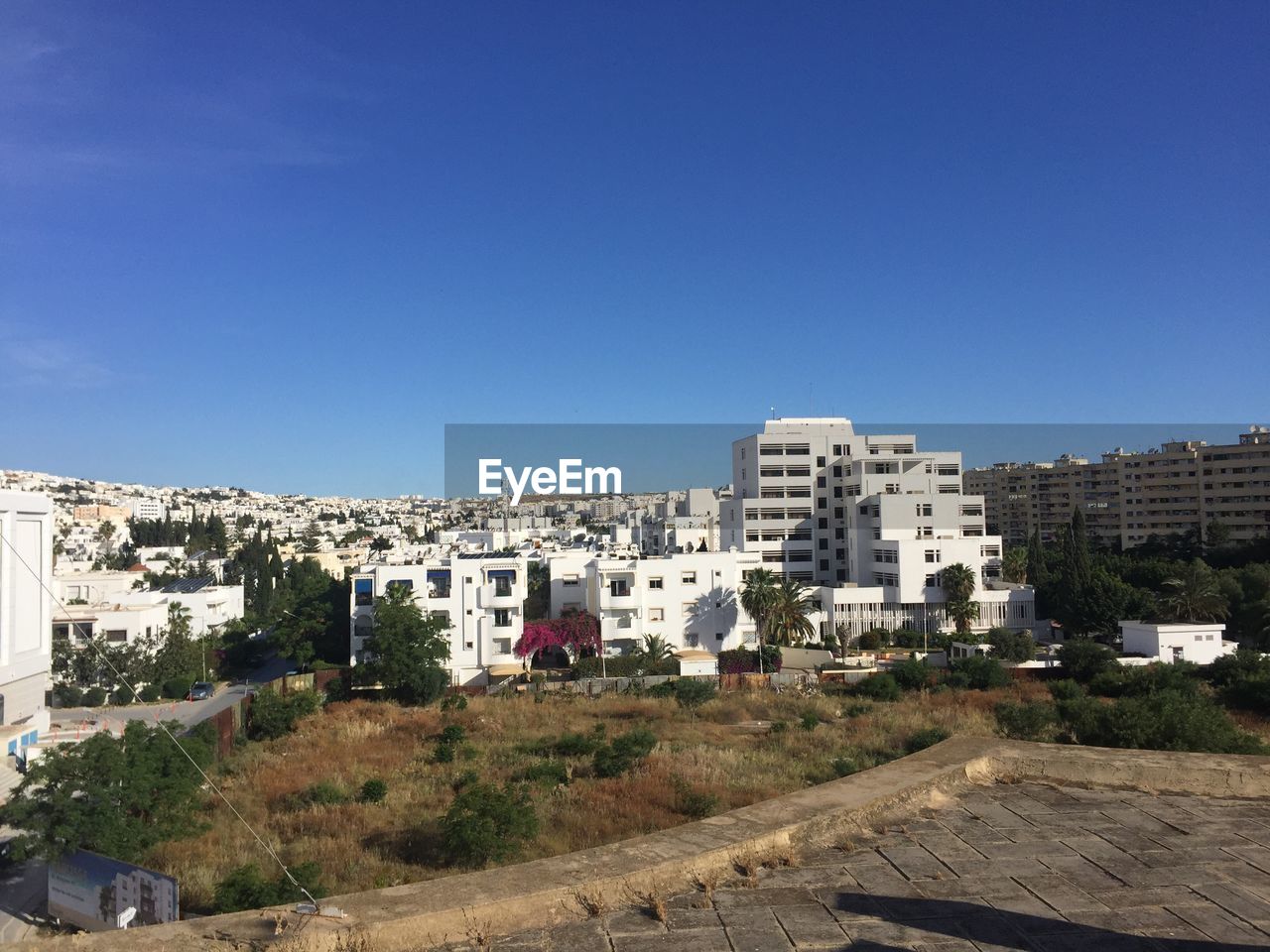 BUILDINGS AGAINST BLUE SKY