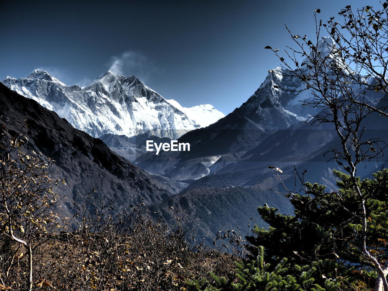 Scenic view of mountains against cloudy sky