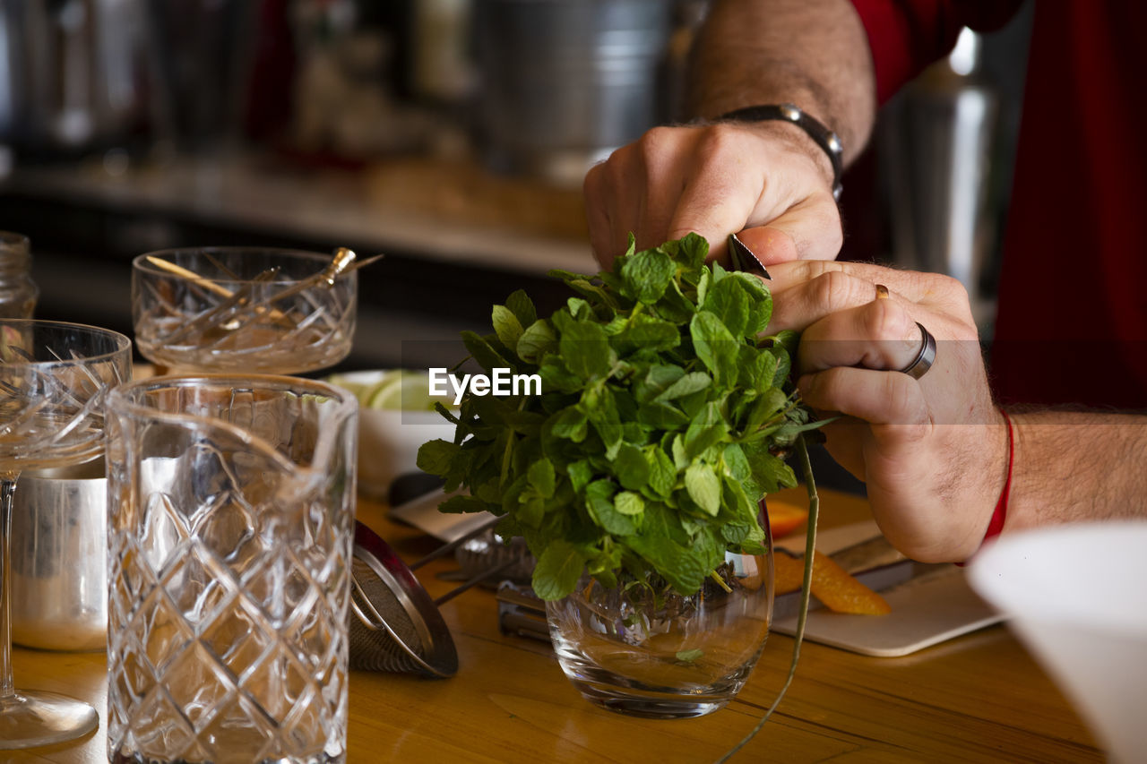 MIDSECTION OF MAN PREPARING FOOD