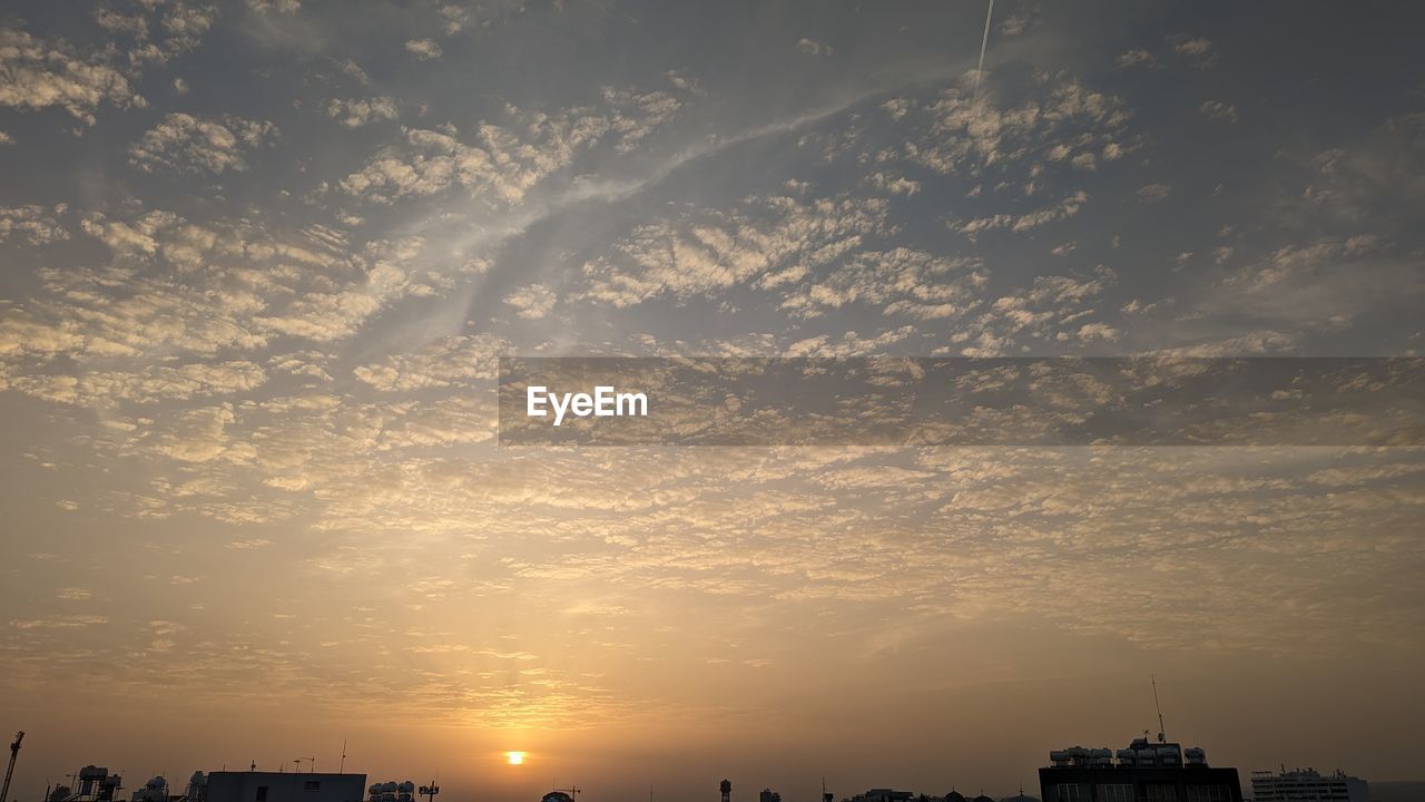 sky, horizon, architecture, city, built structure, building exterior, dawn, morning, cloud, nature, building, sunlight, afterglow, cityscape, sunrise, sun, urban skyline, landscape, beauty in nature, skyline, no people, outdoors, environment, silhouette, travel destinations, dramatic sky, city life, scenics - nature, office building exterior, skyscraper, residential district, cloudscape, tranquility, business finance and industry, water, travel